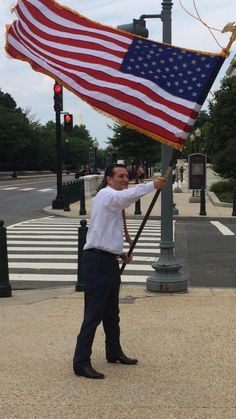 Ted Cruz, waving American Flag.. I can't imagine Obama EVER doing this ...