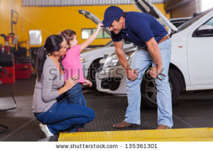 stock-photo-cute-little-girl-playing-with-auto-mechanic-in-garage