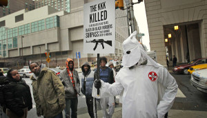 ... KKK costume last week to draw attention to the epidemic of black-on