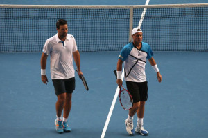 ... exit ... Lleyton Hewitt (R) and Pat Rafter during their doubles match
