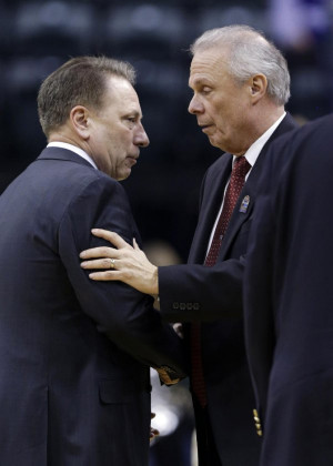 head coach Bo Ryan shake hands after an NCAA college basketball
