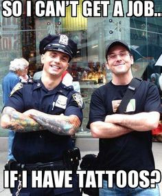 Tattooed and employed. Police officer posing in New York City with a ...