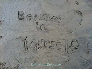 Confidence building quote written in sand at beach: Believe in ...