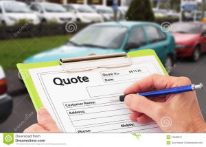 Hand with pen writing a quote or estimate for car repairs.