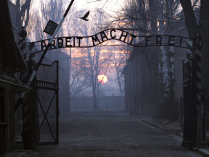 The main gate entering the Nazi Auschwitz death camp at sunrise, with ...