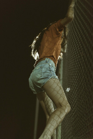 girl shorts vintage night portrait nature fence vertical