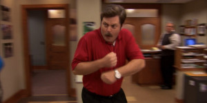 Ron Swanson wearing Tiger Woods red shirt and black pants.