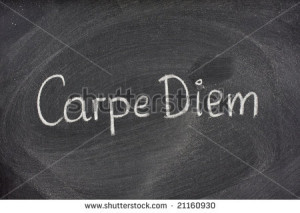 ... Latin phrase, Carpe Diem, a quote from Horace, handwritten with white