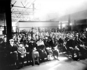 ... immigrants in Immigration Hall, Library and Archives Canada, C-36146
