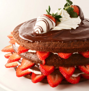 this is a chocolate cake with fresh strawberries and cream filling
