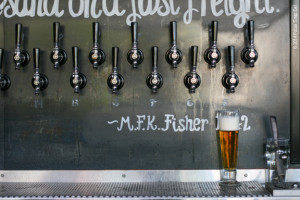 The whimsical bar includes beer quotes and this wall of cool handles ...