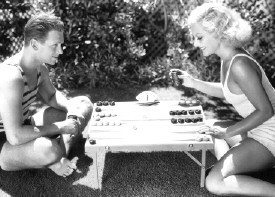July 1931. Joan and husband Doug Fairbanks Jr. at home.