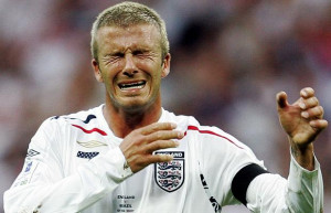 David Beckham reacts after he missed a free-kick and hit the goalpost ...