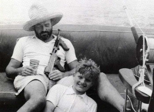 Ernest Hemingway relaxing on his boat with a pina colada, a tommy gun ...
