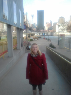 One little girl standing on Roosevelt Island with Manhattan behind her ...
