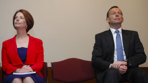 Tony Abbott and Julia Gillard sit next to each other AAP: Lukas Coch