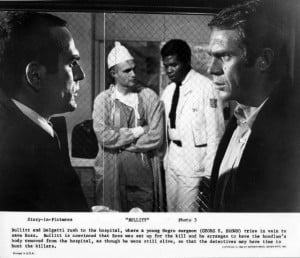Georg Stanford Brown) and nurse discuss the patient in the background ...