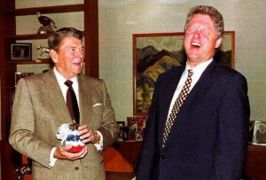Former President Ronald Reagan presents then-President-elect Clinton ...