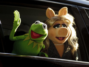 Miss Piggy and Kermit the Frog sign on as presenters