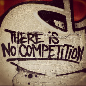 Photo of the quote “there is no competition” written in spray ...