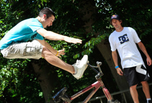 ... with travis travis showing a $ 1 bill autographed by travis pastrana