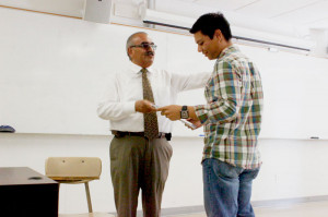 Student Services Oscar Valeriano (left) presented the Jack Kent Cooke