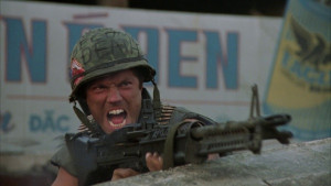 ... Adam Baldwin ) shoulders his M60 while looking over the dead Marines