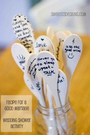 at a wedding shower write advice to a couple on spoons. The couple ...