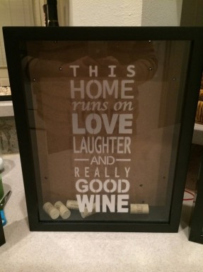 Shadow Box Wine Cork holder. Quote says This home runs on love ...