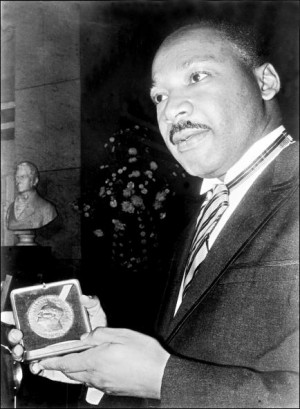 ... Jr. displays his Nobel Peace Prize in Oslo, Norway, Dec. 10, 1964