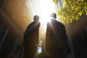 Two businessmen looking up into the sun. - Oli Kellett/ Iconica/ Getty ...