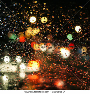 stock-photo-rain-drops-on-car-glass-in-rainy-night-158059544.jpg