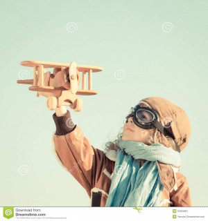 Happy kid playing with toy airplane