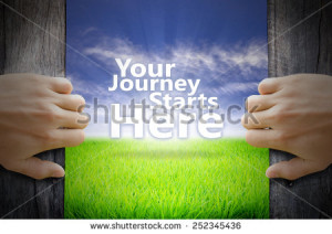 Your Journey Starts Here motivational quotes. Hand opening an old ...