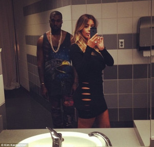 Kim Kardashian forgoes her underwear to slip into daring cut-out dress ...