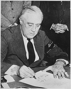 Franklin Roosevelt signing Declaration of War against Japan, December ...
