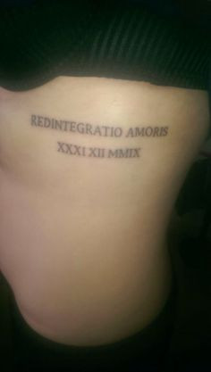 Latin quote tattoo on ribs