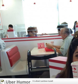 Old man eating by himself at In N Out with a picture of his wife.