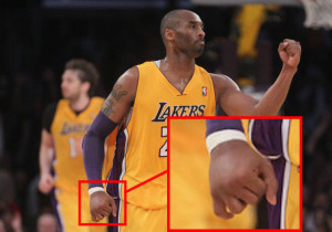 Kobe's injecting fluids into his hands to fake his injury.