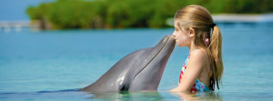 young girl and her dolphin friend