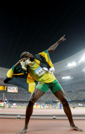 Jamaica's Usain Bolt celebrates winning his third gold medal after the ...