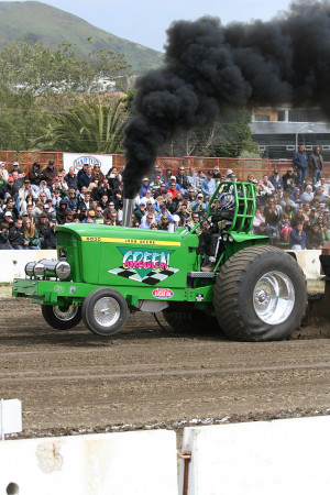 Who ran the first two-stage turbocharged tractor in sled pulling?