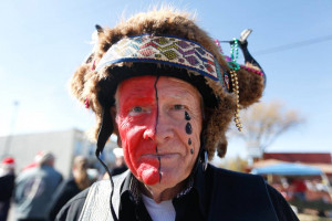 Gary Ackerman wears a shaman 39 s headress during the Wichita Toy Run