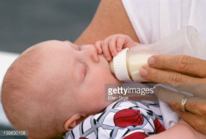 High-Res Stock Photography: Newborn baby boy being bottle fed by…