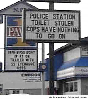 ... police signs: Police station toilet stole. Cops have nothing to go on