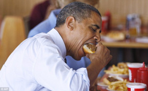 What would Michelle say? President Obama wolfs down TWO chili dogs and ...