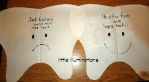 made 2 giant tooth cut outs, one with a smile and one with a frown ...