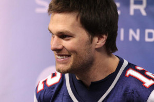 ... Tom Brady (12) smiles during media day in preparation for Super Bowl
