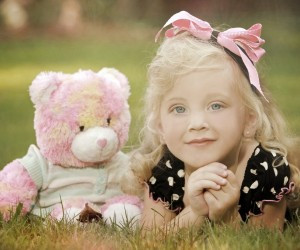 Teddy bear with cute little girl