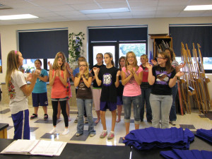 junior cammey hast teaches new cheers to a slew of 7th and 8th graders